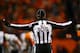 DENVER, CO - JANUARY 12: Back judge Dino Paganelli #105 makes a call during the AFC Divisional Playoff Game between the Denver Broncos and the San Diego Chargers at Sports Authority Field at Mile High on January 12, 2014 in Denver, Colorado. (Photo by D