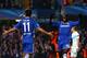 LONDON, ENGLAND - DECEMBER 11: Demba Ba of Chelsea celebrates with teammate Oscar #11 after scoring the opening goal during the UEFA Champions League Group E match between Chelsea and FC Steaua Bucuresti at Stamford Bridge on December 11, 2013 in London,