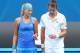 MELBOURNE, AUSTRALIA - JANUARY 24: Kristina Mladenovic of France and Daniel Nestor of Canada talk tactics against Jie Zheng of China and Scott Lipsky of the United States in their mixed doubles semifinal match during day 12 of the 2014 Australian Open at