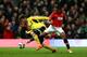 MANCHESTER, ENGLAND - JANUARY 22: Marcos Alonso of Sunderland and Antonio Valencia of Manchester United compete for the ball during the Capital One Cup semi final, second leg match between Manchester United and Sunderland at Old Trafford on January 22, 2