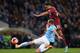 MANCHESTER, ENGLAND - JANUARY 25: Ikechi Anya of Watford shoots past Pablo Zabaleta of Manchester City during the FA Cup Fourth Round match sponsored by Budweiser between Manchester City and Watford at Etihad Stadium on January 25, 2014 in Manchester, En