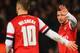 LONDON, ENGLAND - JANUARY 24: Santi Cazorla of Arsenal (R) celebrates with Jack Wilshere of Arsenal as he scores their fourht goal during the FA Cup with Budweiser Fourth round match between Arsenal and Coventry City at Emirates Stadium on January 24, 20