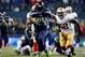 SEATTLE, WA - JANUARY 19: Running back Marshawn Lynch #24 of the Seattle Seahawks carries the ball against the San Francisco 49ers during the 2014 NFC Championship at CenturyLink Field on January 19, 2014 in Seattle, Washington. (Photo by Jonathan Ferre