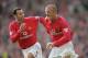 19 Aug 2001: David Beckham of Manchester United celebrates scoring a freekick with team mate Ryan Giggs during the FA Barclaycard Premiership match against Fulham played at Old Trafford in Manchester, England. Man Utd won the game 3 - 2. \ Mandatory Cre