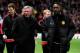 MANCHESTER, ENGLAND - FEBRUARY 23: Manchester United Manager Sir Alex Ferguson walks to the bench with Danny Welbeck prior to the UEFA Europa League Round of 32 second leg match between Manchester United and AFC Ajax at Old Trafford on February 23, 2012