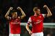 LONDON, ENGLAND - NOVEMBER 02: Laurent Koscielny of Arsenal and Per Mertesacker of Arsenal celebrate victory at the final whistle during the Barclays Premier League match between Arsenal and Liverpool at Emirates Stadium on November 2, 2013 in London, En