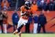 DENVER, CO - JANUARY 12: Trindon Holliday #11 of the Denver Broncos returns a punt for a 70-yard touchdown in the first quarter against the Baltimore Ravens during the AFC Divisional Playoff Game at Sports Authority Field at Mile High on January 12, 2013