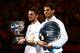 MELBOURNE, AUSTRALIA - JANUARY 26: Stanislas Wawrinka of Switzerland holds the Norman Brookes Challenge Cup after winning, and Rafael Nadal of Spain holds the runner up plate after their men's final match during day 14 of the 2014 Australian Open at Melb