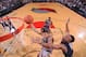 Dante Exum finishing around Jabari Parker
