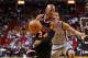 MIAMI, FL - JANUARY 26: Ray Allen #34 of the Miami Heat drives past Cory Joseph #5 of the San Antonio Spurs during a game at American Airlines Arena on January 26, 2014 in Miami, Florida. NOTE TO USER: User expressly acknowledges and agrees that, by down