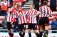 SUNDERLAND, ENGLAND - JANUARY 25: Charis Mavrias (2nd left) of Sunderland celebrates with team mates after scoring during the FA Cup Fourth Round match between Sunderland and Kidderminster Harriers at the Stadium of Light on January 25, 2014 in Sunderlan
