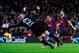 BARCELONA, SPAIN - JANUARY 26: Alexis Sanchez of FC Barcelona scores his team's third goal under a challenge by Willy Caballero of Malaga CF during the La Liga match between FC Barcelona and Malaga CF at Camp Nou on January 26, 2014 in Barcelona, Spain.