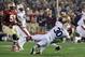 Jan 6, 2014; Pasadena, CA, USA; Florida State Seminoles quarterback Jameis Winston (5) is tackled by Auburn Tigers defensive end Dee Ford (30) during the first half of the 2014 BCS National Championship game at the Rose Bowl. Mandatory Credit: Jayne Kami