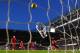 LONDON, ENGLAND - DECEMBER 29: Goalkeeper Simon Mignolet of Liverpool dives in vain as Eden Hazard of Chelsea scores his team's first goal during the Barclays Premier League match between Chelsea and Liverpool at Stamford Bridge on December 29, 2013 in L