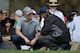 Jordan Spieth talks to a tour official about his injured ankle.