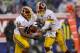 EAST RUTHERFORD, NJ - DECEMBER 29: Kirk Cousins #12 hands off to Alfred Morris #46 of the Washington Redskins during their game against the New York Giants at MetLife Stadium on December 29, 2013 in East Rutherford, New Jersey. (Photo by Jeff Zelevansk