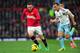 MANCHESTER, ENGLAND - DECEMBER 21: Wayne Rooney of Manchester United competes with Mark Noble of West Ham United during the Barclays Premier League match between Manchester United and West Ham United at Old Trafford on December 21, 2013 in Manchester, En