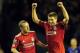 LIVERPOOL, ENGLAND - MARCH 13: Jay Spearing and Steven Gerrard of Liverpool celebrate victory in the Barclays Premier League match between Liverpool and Everton at Anfield on March 13, 2012 in Liverpool, England. (Photo by Jamie McDonald/Getty Images)
