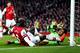 LONDON, ENGLAND - JANUARY 18: Bacary Sagna of Arsenal beats Maarten Stekelenburg of Fulham to the ball during the Barclays Premier League match between Arsenal and Fulham at Emirates Stadium on January 18, 2014 in London, England. (Photo by Clive Mason/