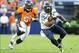 Aug 18, 2012; Denver, CO, USA; Seattle Seahawks running back Marshawn Lynch (24) is pursued by Denver Broncos linebacker Joe Mays (51) in the first quarter at Sports Authority Field. Mandatory Credit: Byron Hetzler-USA TODAY Sports