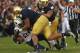 SOUTH BEND, IN - OCTOBER 20: Jamaal Williams #21 of the BYU Cougars is dropped by Stephon Tuitt #7, Louis Nix III #9 and Manti T'eo #5 of the Notre Dame Fighting Irish at Notre Dame Stadium on October 20, 2012 in South Bend, Indiana. Notre Dame defeated B