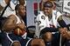 July 14, 2012; Washington, DC, USA; United States forward Kobe Bryant (10) and United States forward Carmelo Anthony (15) smile on the sidelines during USA team training at the DC Armory. Mandatory Credit: Geoff Burke-USA TODAY Sports