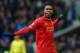 LIVERPOOL, ENGLAND - NOVEMBER 23: Daniel Sturridge of Liverpool celebrates scoring his team's third goal during the Barclays Premier League match between Everton and Liverpool at Goodison Park on November 23, 2013 in Liverpool, England. (Photo by Alex L