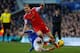 LIVERPOOL, ENGLAND - DECEMBER 29: Luke Shaw of Southampton is tackled by Steven Naismith of Everton during the Barclays Premier League match between Everton and Southampton at Goodison Park on December 29, 2013 in Liverpool, England. (Photo by Paul Thom