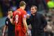 LIVERPOOL, ENGLAND - JANUARY 18: Brendan Rodgers, manager of Liverpool talks to Steven Gerrard during the Barclays Premier League match between Liverpool and Aston Villa at Anfield on January 18, 2014 in Liverpool, England. (Photo by Michael Regan/Getty