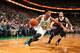 BOSTON, MA - JANUARY 26: Phil Pressey #26 of the Boston Celtics drives against Deron Williams #8 of the Brooklyn Nets during a game at TD Garden in Boston. NOTE TO USER: User expressly acknowledges and agrees that, by downloading and or using this photogr