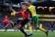 NORWICH, ENGLAND - DECEMBER 28: Nemanja Vidic of Manchester United battles with Gary Hooper of Norwich City during the Barclays Premier League match between Norwich City and Manchester United at Carrow Road on December 28, 2013 in Norwich, England. (Ph