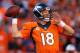 DENVER, CO - JANUARY 19: Peyton Manning #18 of the Denver Broncos looks to throw a pass against the New England Patriots during the AFC Championship game at Sports Authority Field at Mile High on January 19, 2014 in Denver, Colorado. (Photo by Justin Ed