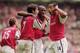 8 Apr 2001: Patrick Vieira (centre) celebrates scoring the equalising goal with team-mates Robert Pires (left) and Thierry Henry (right) all of Arsenal during the AXA sponsored FA Cup Semi-Final match against Tottenham Hotspur played at Old Trafford, inM