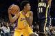 Jan 28, 2014; Los Angeles, CA, USA; Los Angeles Lakers small forward Nick Young (0) looks around Indiana Pacers small forward Paul George (24) during the first half at Staples Center. Mandatory Credit: Richard Mackson-USA TODAY Sports