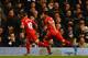 LONDON, ENGLAND - DECEMBER 15: Captain Luis Suarez of Liverpool celebrates scoring the opening goal with Philippe Coutinho of Liverpool during the Barclays Premier League match between Tottenham Hotspur and Liverpool at White Hart Lane on December 15, 2