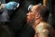 Jun 22, 2012; Atlantic City, NJ, USA; Nick Catone has blood wiped from his forehead in a middleweight bout against Chris Camozziduring UFC on FX at Revel Resort and Casino. Chris Camozzi won the fight by technical knockout in in the third round. Mandato