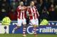 STOKE ON TRENT, ENGLAND - JANUARY 12: Charlie Adam of Stoke City celebrates with Jonathan Walters (L) as he scores their second goal during the Barclays Premier League match between Stoke City and Liverpool at Britannia Stadium on January 12, 2014 in Sto