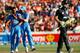 HAMILTON, NEW ZEALAND - JANUARY 28: Martin Guptill of New Zealand walks off as Mohammed Shami (L) and Rohit Sharma (R) of India celebrate his dismissal during game four of the men's one day international series between New Zealand and India at Seddon Par