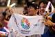 TOKYO, JAPAN - SEPTEMBER 08: Residents of Olympic bid city Tokyo celebrate while holding Tokyo signs after the announcement of the 2020 Summer Olympic Games host city at Komazawa Olympic Park on September 8, 2013 in Tokyo, Japan. Madrid was the first cit