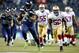 SEATTLE, WA - JANUARY 19: Running back Marshawn Lynch #24 of the Seattle Seahawks runs for a 40-yard touchdown in the third quarter against the San Francisco 49ers during the 2014 NFC Championship at CenturyLink Field on January 19, 2014 in Seattle, Wash