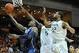 Feb 5, 2014; Coral Gables, FL, USA; Pittsburgh Panthers forward Michael Young (2) shoots the ball in front of Miami Hurricanes guard Davon Reed (5) and Miami Hurricanes forward Donnavan Kirk (22) during the first half at BankUnited Center. Mandatory Credi