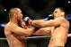 Feb 23, 2013; Anaheim, CA, USA; Dan Henderson (blue gloves) fights Lyoto Machida (red gloves) during their UFC welterweight bout at the Honda Center. Mandatory Credit: Jayne Kamin-Oncea-USA TODAY Sports