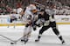 PITTSBURGH, PA - JANUARY 27: Kris Letang #58 of the Pittsburgh Penguins battles for the puck against Cody Hodgson #19 of the Buffalo Sabres on January 27, 2014 at Consol Energy Center in Pittsburgh, Pennsylvania. (Photo by Gregory Shamus/NHLI via Getty