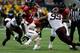 Hageman (No. 99) causing his usual wreckage in the backfield.
