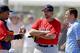 A two-time World Series champ with the Red Sox, Jason Varitek (middle) is now a special assistant to GM Ben Cherington (right).