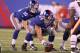 EAST RUTHERFORD, NJ - AUGUST 22: Eli Manning #10 and David Baas #64 of the New York Giants in action during their pre season game on August 22, 2011 at The New Meadowlands Stadium in East Rutherford, New Jersey. (Photo by Al Bello/Getty Images)