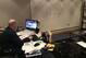 Clifford studying game film at his desk.