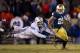 Nov 23, 2013; South Bend, IN, USA; Notre Dame Fighting Irish running back Tarean Folston (25) carries the ball as BYU Cougars linebacker Kyle Van Noy (3) attempts to tackle in the fourth quarter at Notre Dame Stadium. Notre Dame won 23-13. Mandatory Credi