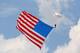 JOLIET, IL - JULY 21: A parachutist dives with the American flag during the National Anthem before the STP NASCAR Nationwide Series race at Chicagoland Speedway on July 21, 2013 in Joliet, Illinois. (Photo by Jonathan Daniel/Getty Images)