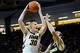 Feb 8, 2014; Iowa City, IA, USA; Iowa Hawkeyes guard-forward Aaron White (30) attempts a shot over Michigan Wolverine guard Nik Stauskas (11) at Carver-Hawkeye Arena. Iowa defeated Michigan 85-67. Mandatory Credit: Steven Branscombe-USA TODAY Sports
